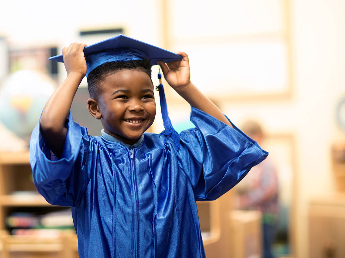Kindergarten graduate in cap and gown