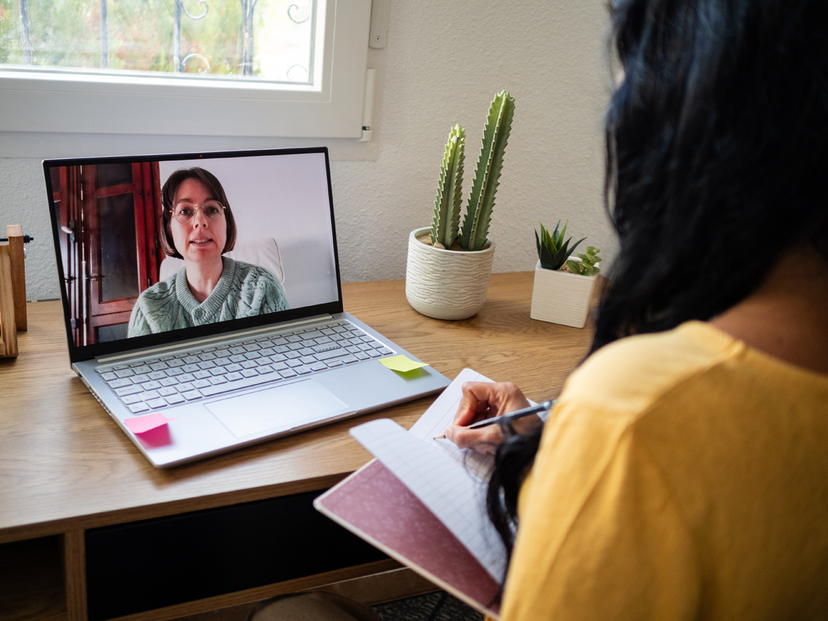 Women discussing care options virtually with care expert