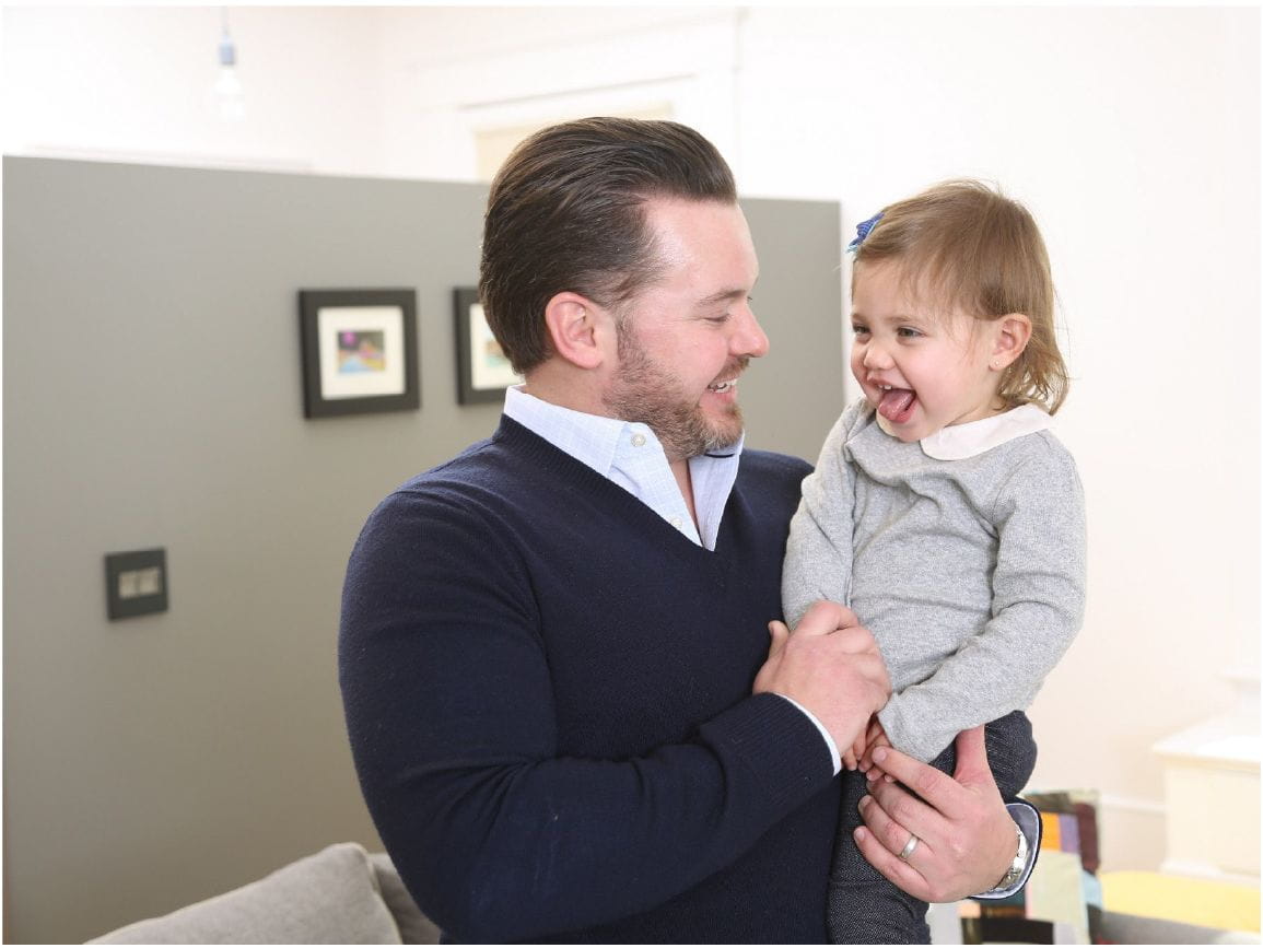 Man holding laughing child