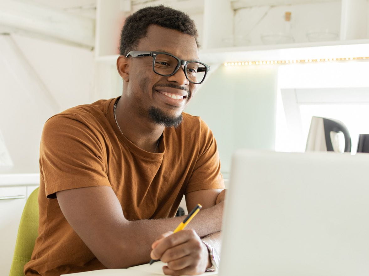 happy worker at his desk
