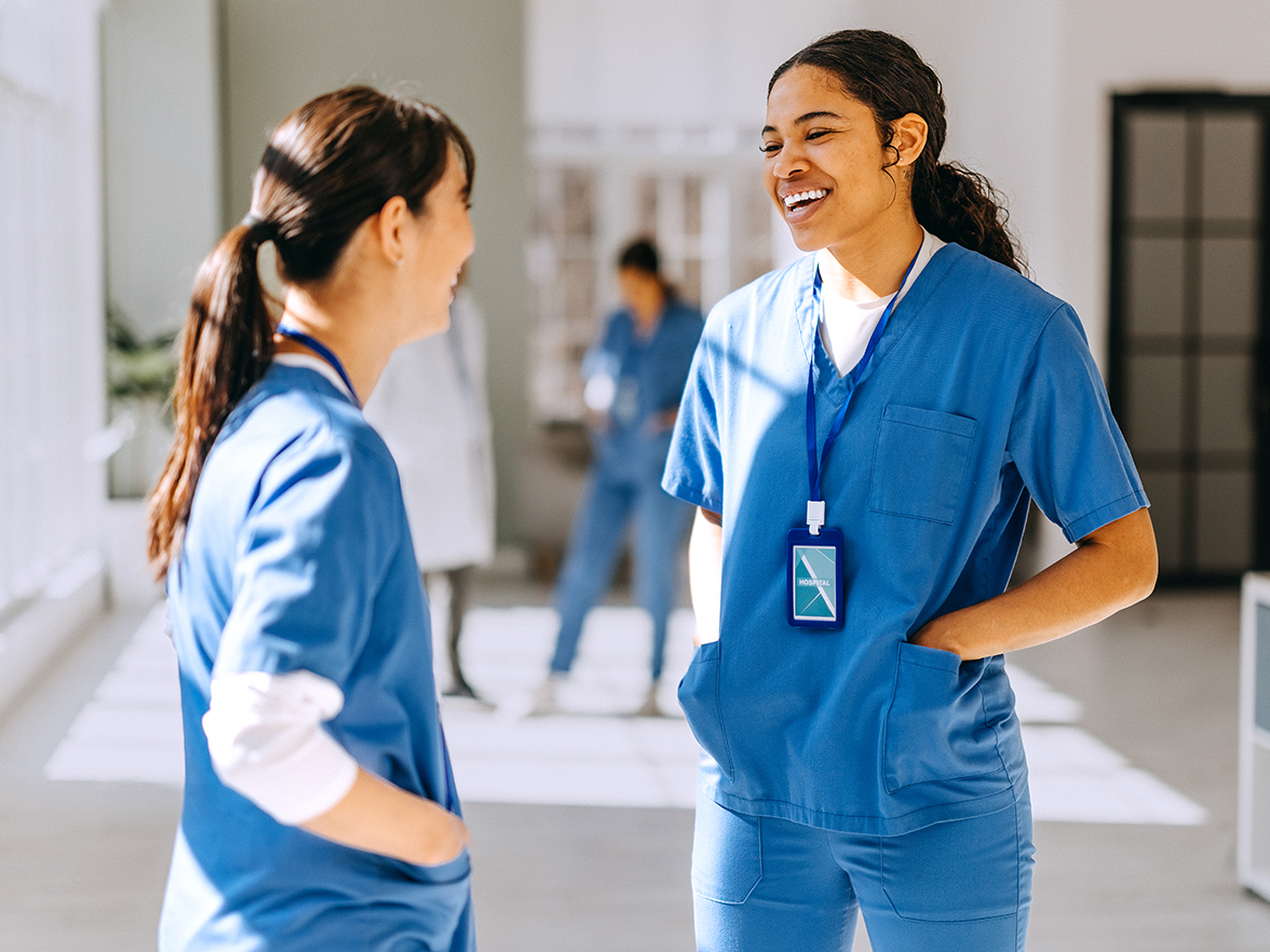 Two healthcare workers chatting