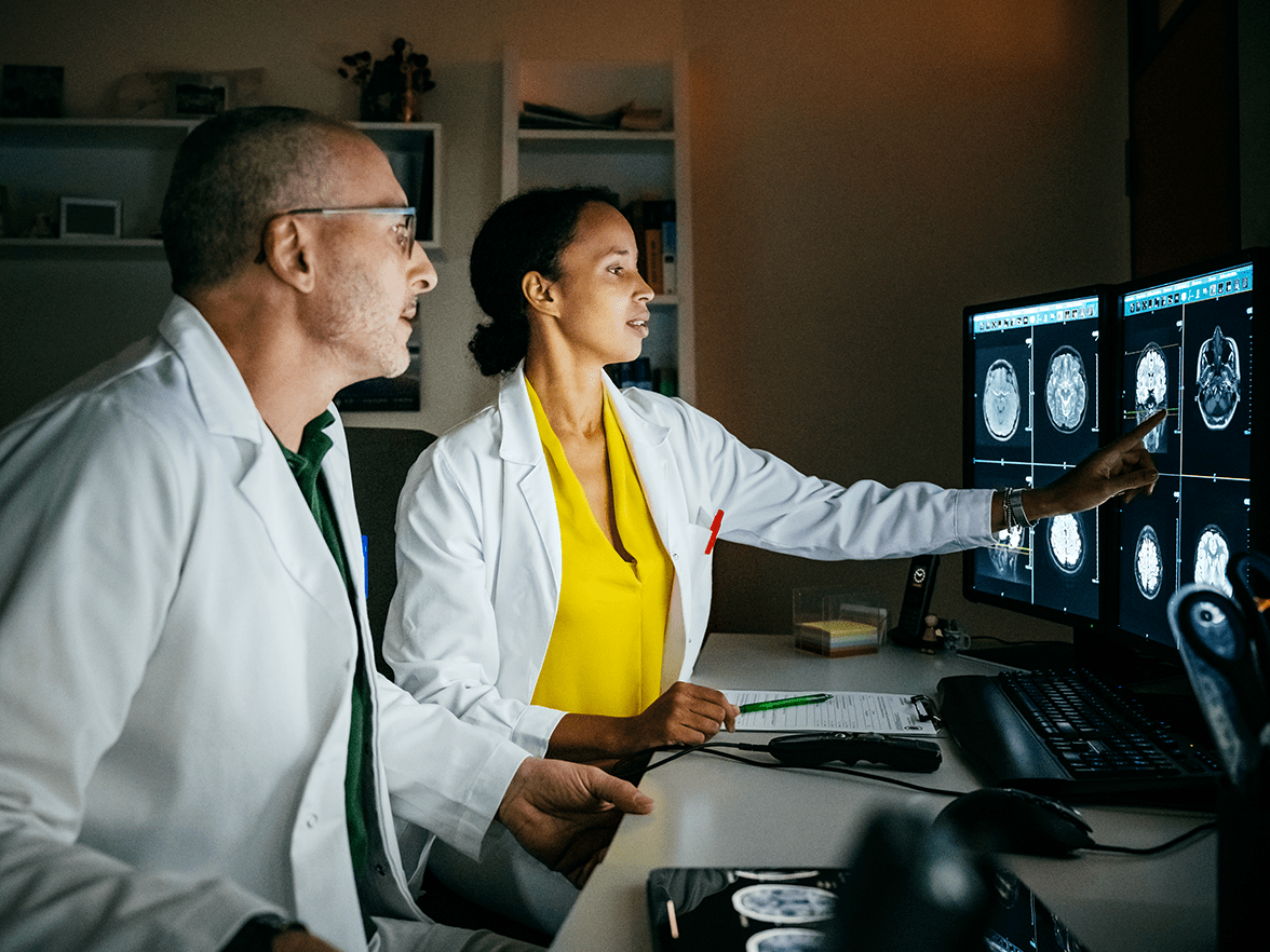 Two healthcare workers analyzing test results
