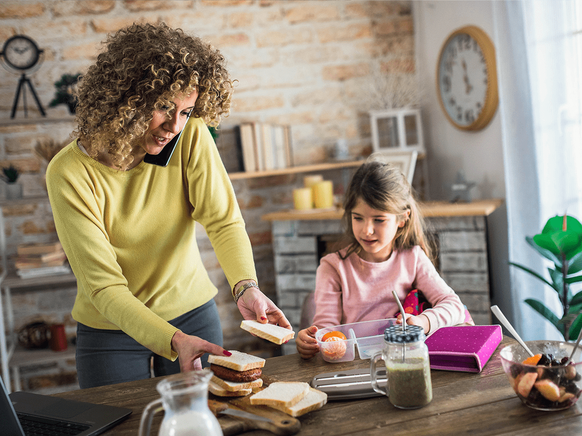 busy mother at home with daughter