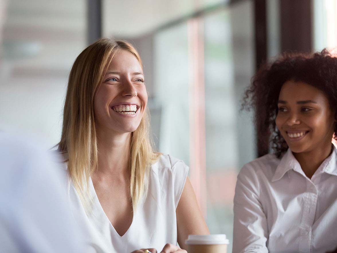 Bright Horizons Modern Family Index Woman Smiling with Coworkers