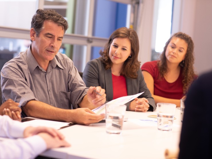 co-workers sitting at table