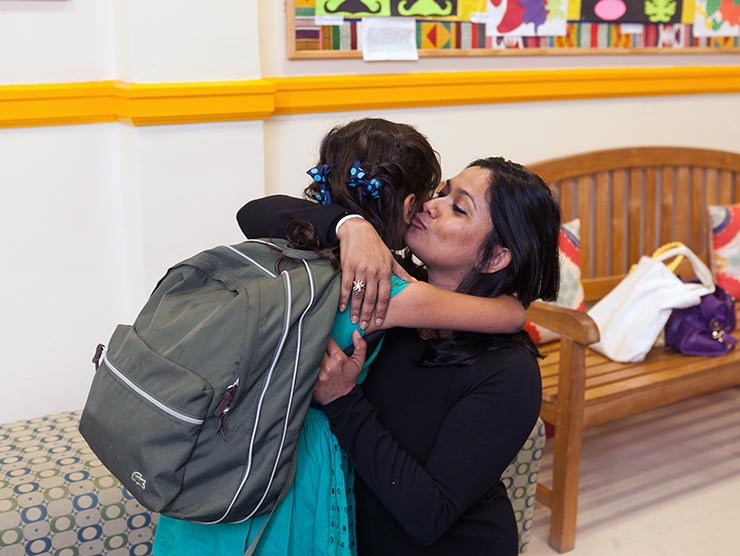 Mother dropping off or picking up daughter