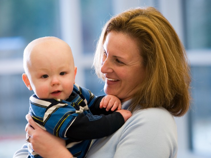 mom holding child