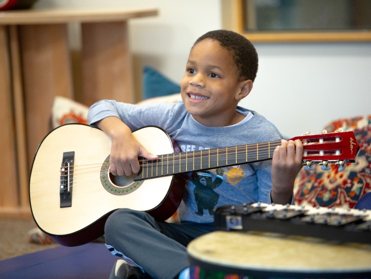 child playing guitar