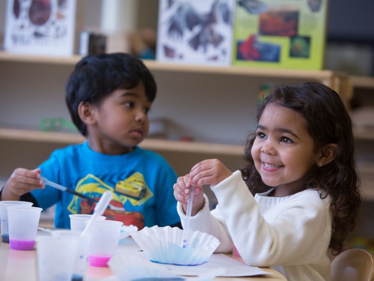 children sitting at table 