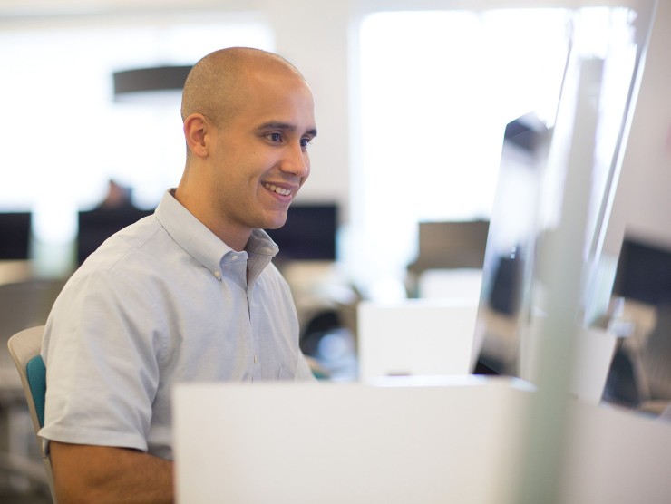 man sitting with laptop