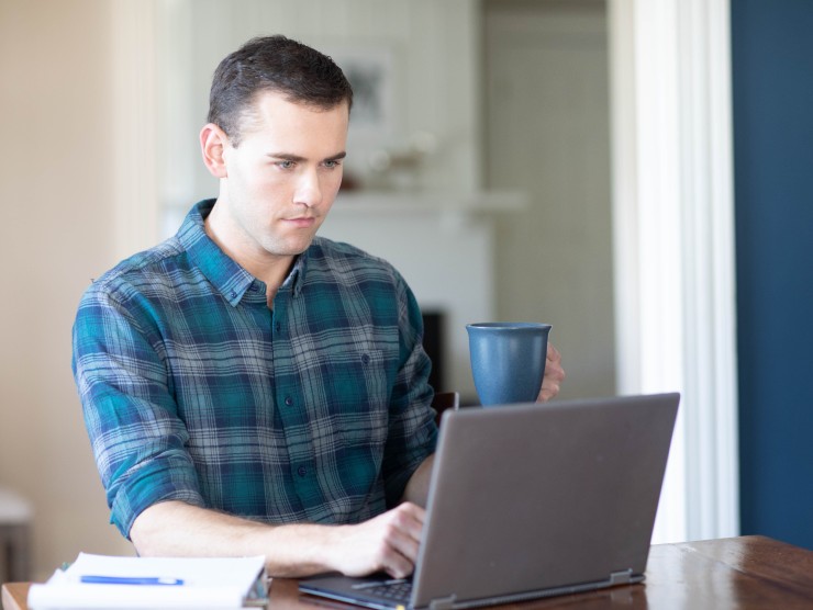 man sitting with laptop