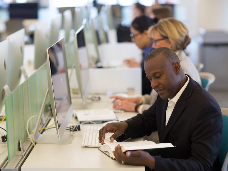 man sitting at laptop