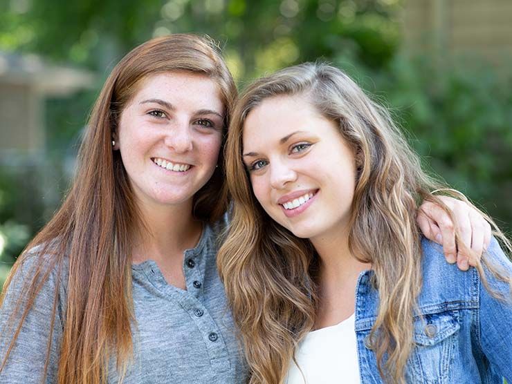 Two young women smiling