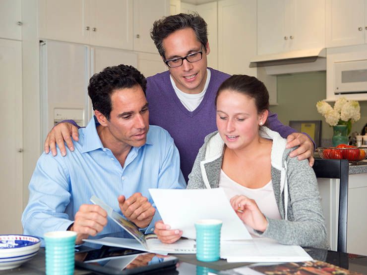 Family looking over college materials