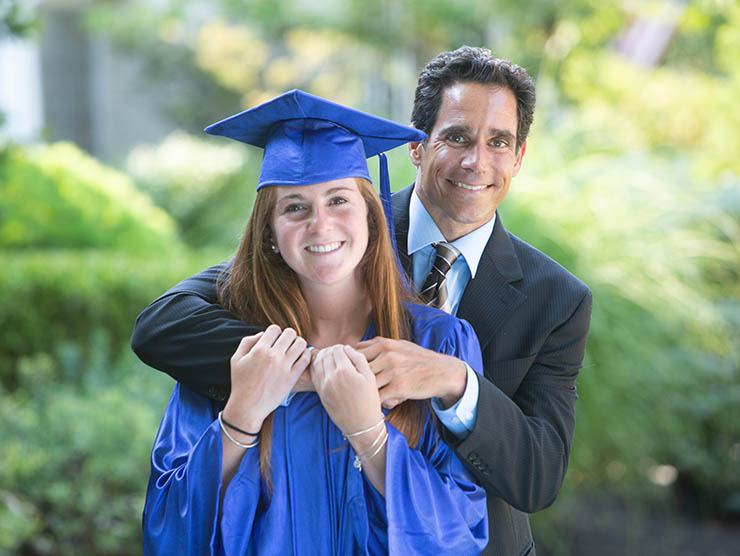 Female graduate with father