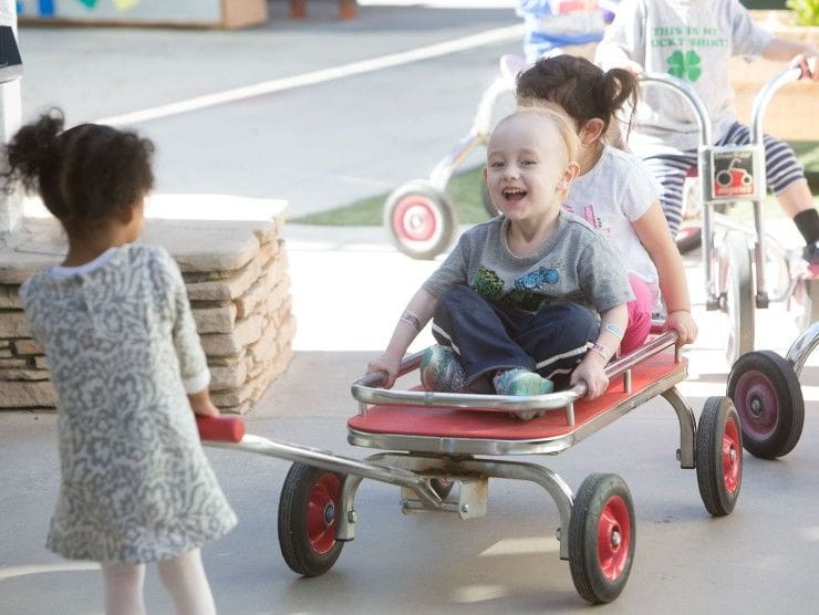 children playing with a wagon 