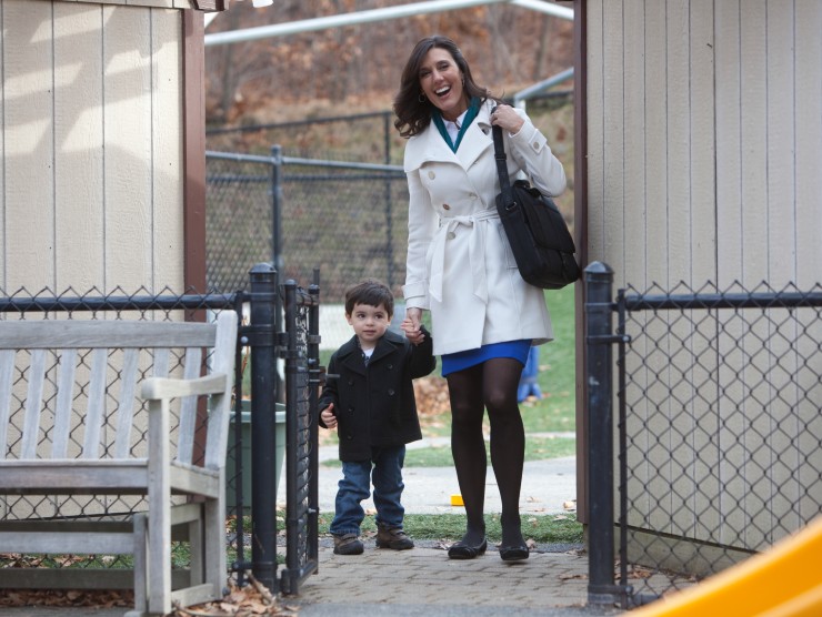 mom walking son into day care