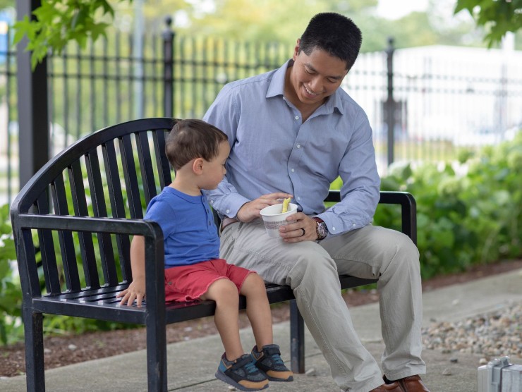 father and son on bench