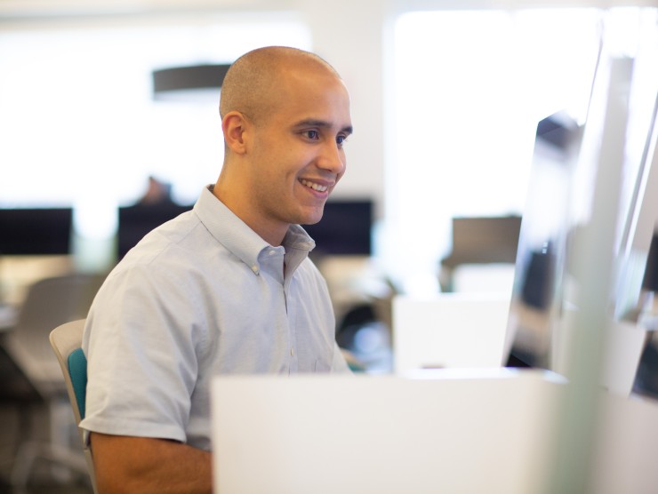 man sitting at computer 