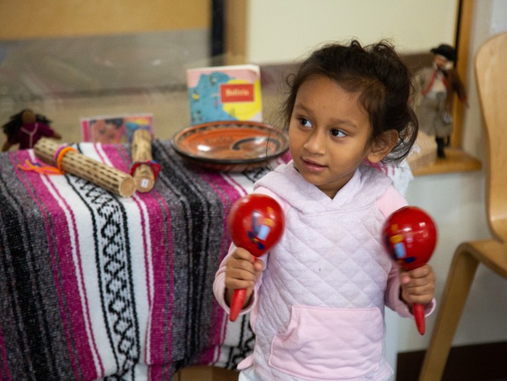 girl holding maracas