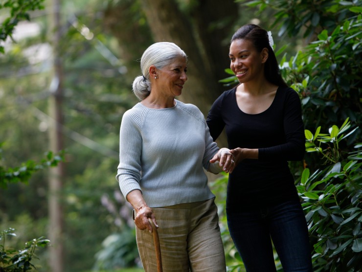 woman and caretaker walking 