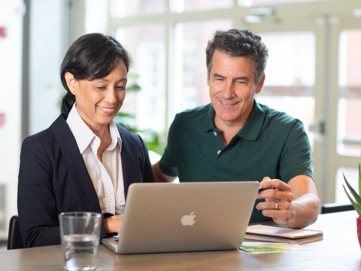 two coworkers sitting at table 