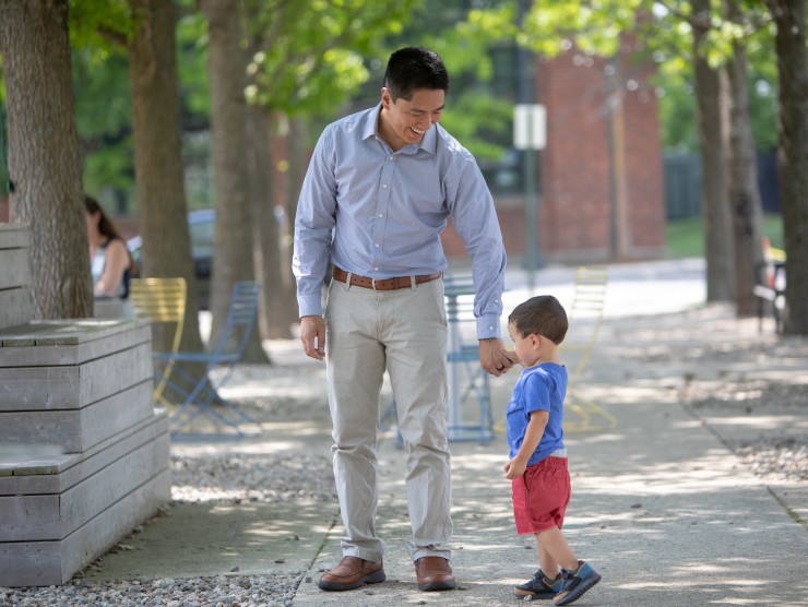 working dad walking with child 