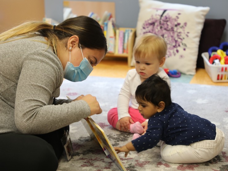 teacher sitting with children 