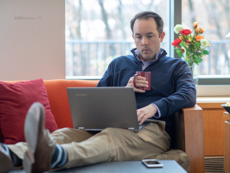 man sitting with laptop