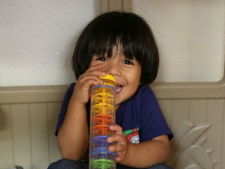 A child plays with a toy at the Bright Space at the Humanitarian Respite Center in McAllen, Texas