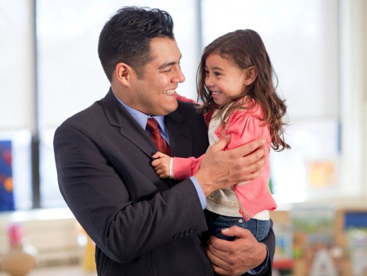 father holding daughter 