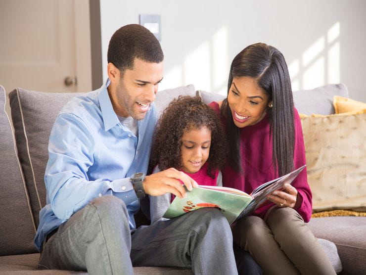 parents reading to child 