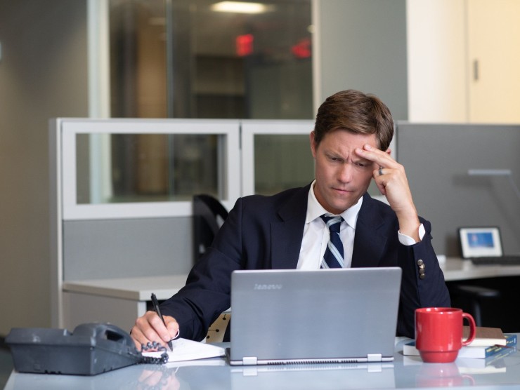 man sitting with laptop