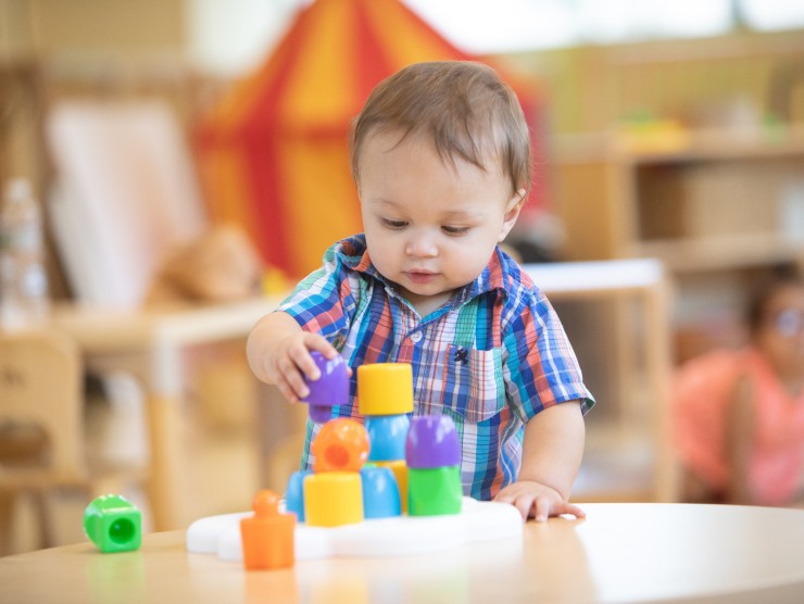 child playing with blocks 