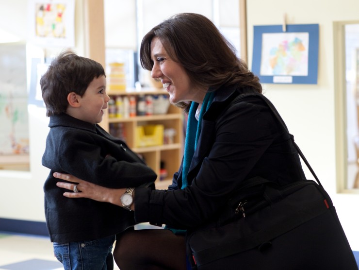 mother dropping off son at child care 