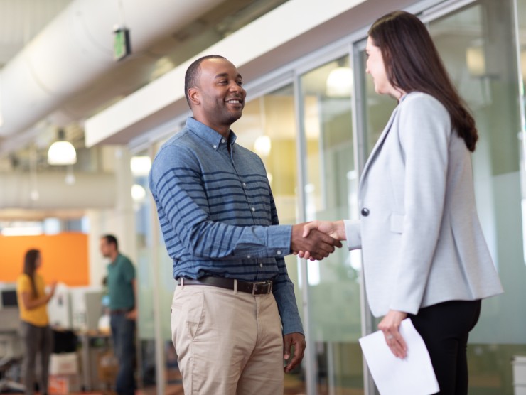 co-workers shaking hands