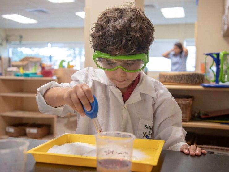 child playing with STEM kit