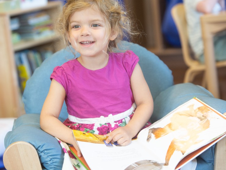 child reading book 