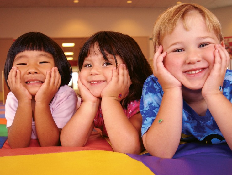 three kids smiling