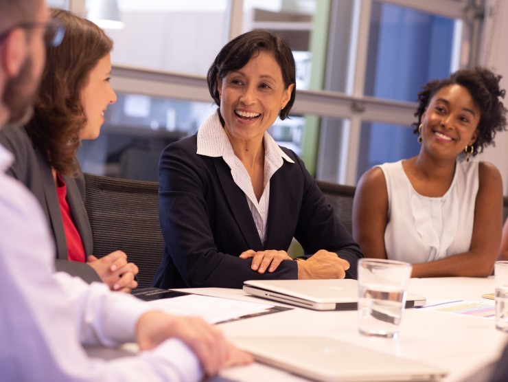 co-workers sitting at table 