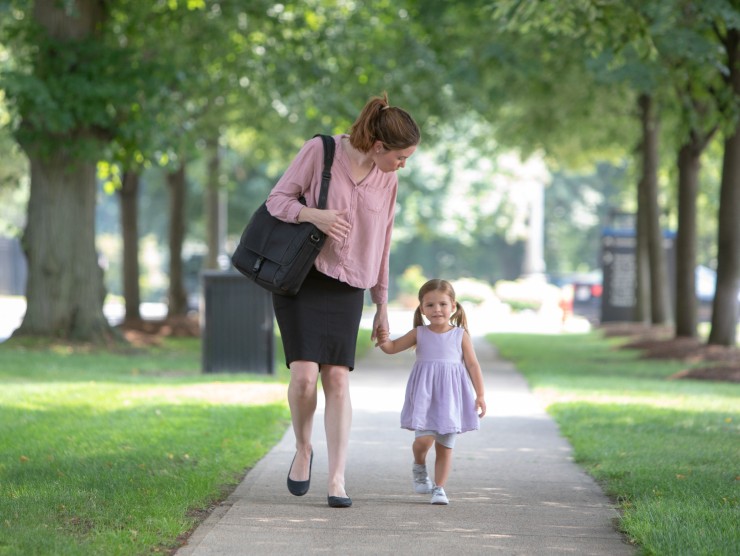 mother walking with daughter 