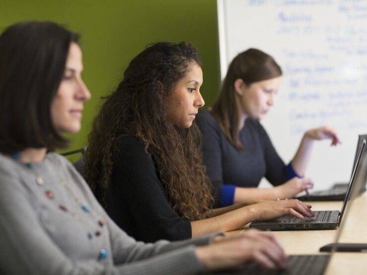 women on laptops