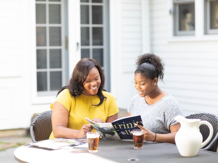 mother and daughter sitting at table 