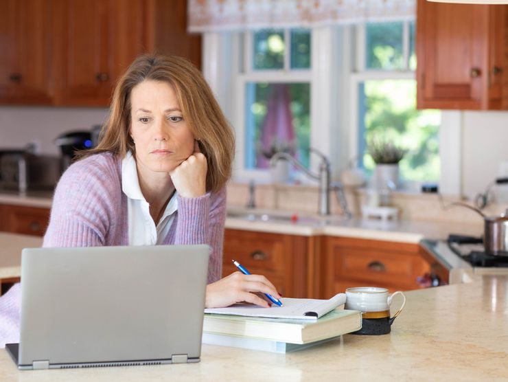 women sitting with laptop