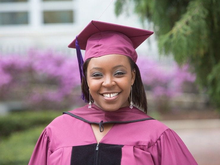 women in graduation cap and gown 