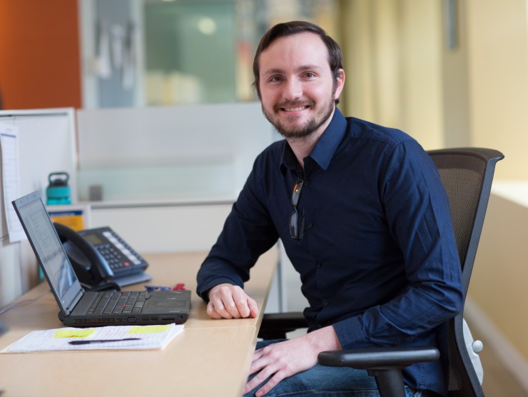 man sitting at desk 