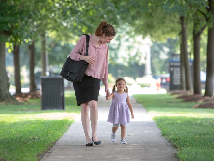 mother walking with daughter 