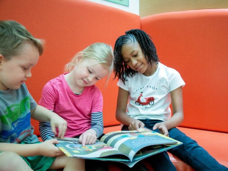 children reading a book 
