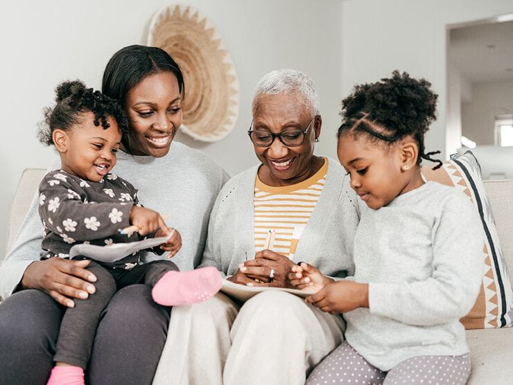 Family of four reviewing care plans together