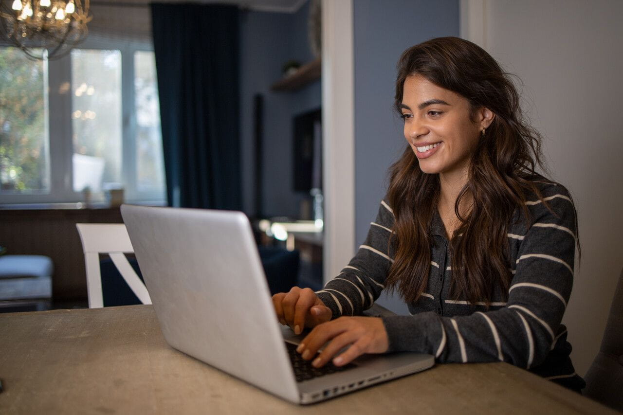Woman at home working on a laptop
